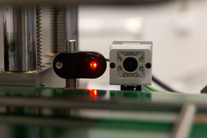 Камера, следящая за ходом перемещения упаковок